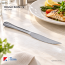 Stainless Steel Dinner Knife V Shape shown in a restaurant dining setting; food and other tableware are styling props